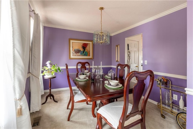 dining space with carpet floors, ornamental molding, and a chandelier