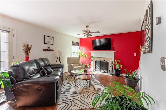 living room with hardwood / wood-style flooring and ceiling fan