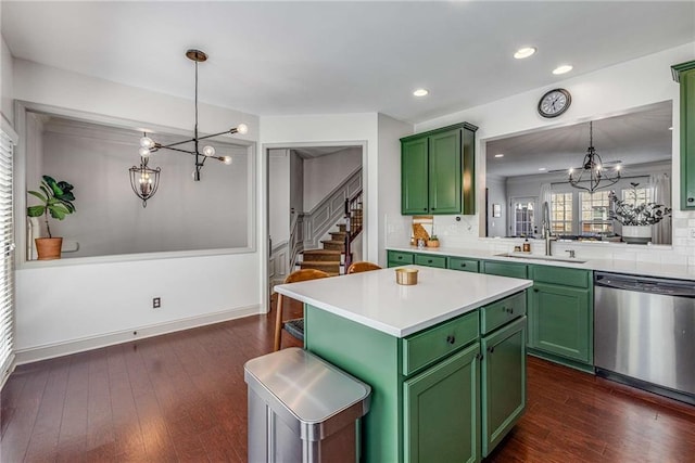 1012 E Paces Chase, Atlanta, GA 30326 - kitchen featuring green cabinetry, a chandelier, a sink, dishwasher, and light countertops