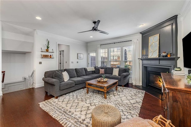 1012 E Paces Chase, Atlanta, GA 30326 - living area with crown molding, ceiling fan, wood finished floors, a glass covered fireplace, and recessed lighting