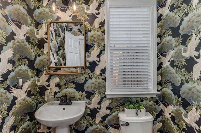 1012 E Paces Chase, Atlanta, GA 30326 - bathroom featuring toilet, a sink, and wallpapered walls