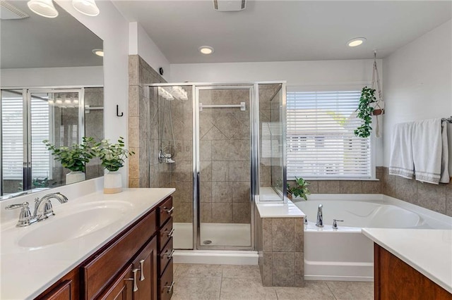 1012 E Paces Chase, Atlanta, GA 30326 - full bathroom featuring vanity, healthy amount of natural light, a bath, tile patterned floors, and recessed lighting