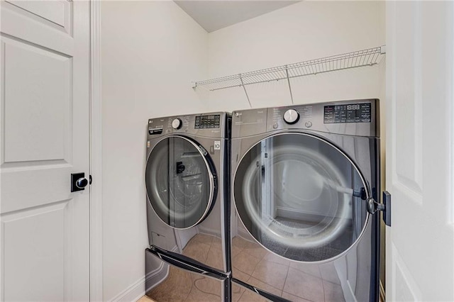 1012 E Paces Chase, Atlanta, GA 30326 - laundry room featuring independent washer and dryer, tile patterned floors, and baseboards