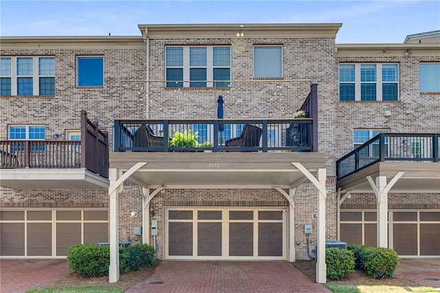 1012 E Paces Chase, Atlanta, GA 30326 - rear view of house featuring brick siding and a balcony