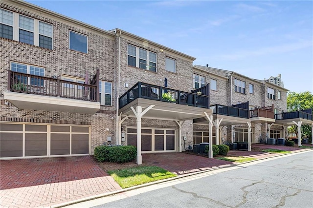 1012 E Paces Chase, Atlanta, GA 30326 - view of building exterior featuring an attached garage and driveway
