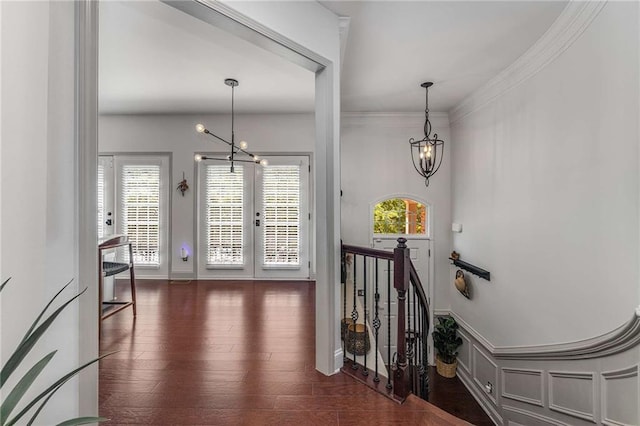 1012 E Paces Chase, Atlanta, GA 30326 - hallway featuring a chandelier, french doors, wood finished floors, crown molding, and an upstairs landing