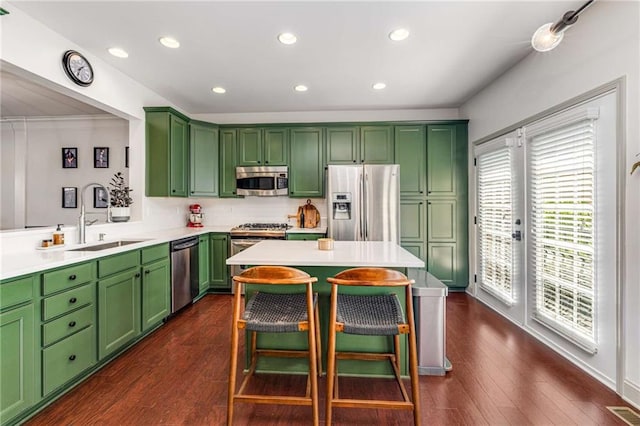 1012 E Paces Chase, Atlanta, GA 30326 - kitchen featuring stainless steel appliances, a sink, light countertops, dark wood-style floors, and recessed lighting