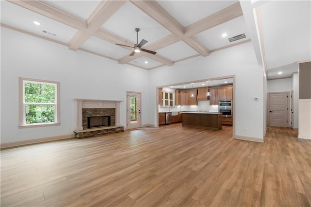 4786 Conns Creek Rd, Ball Ground, GA 30107 - unfurnished living room with light wood-style floors, a ceiling fan, a fireplace, coffered ceiling, and beam ceiling