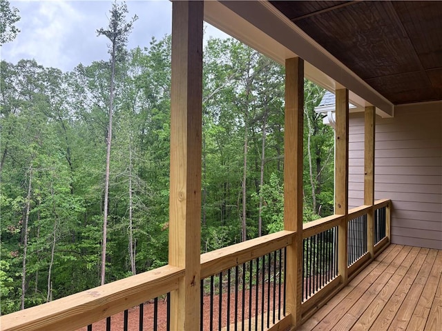 4786 Conns Creek Rd, Ball Ground, GA 30107 - wooden terrace with a wooded view