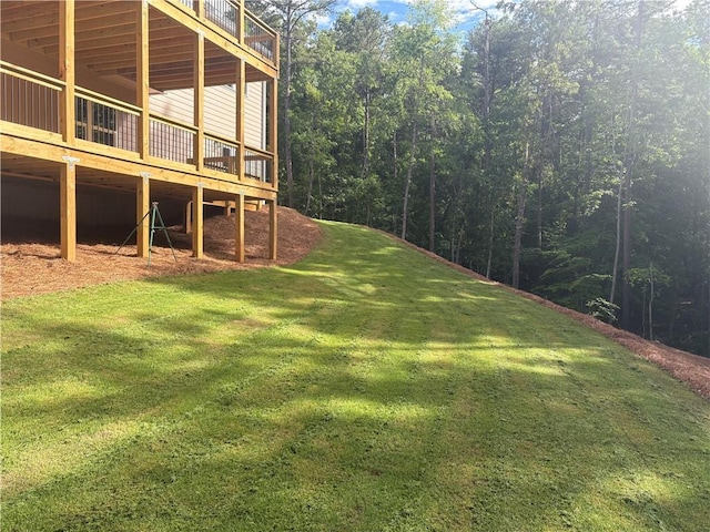 4786 Conns Creek Rd, Ball Ground, GA 30107 - view of grassy yard featuring a wooden deck and a forest view