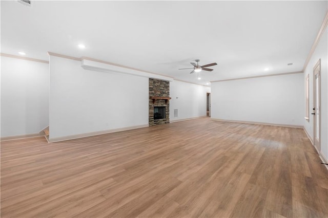 4786 Conns Creek Rd, Ball Ground, GA 30107 - unfurnished living room with ceiling fan, ornamental molding, recessed lighting, light wood-style flooring, and a stone fireplace