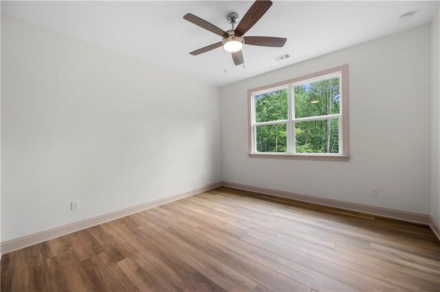4786 Conns Creek Rd, Ball Ground, GA 30107 - empty room featuring wood finished floors, a ceiling fan, and a smoke detector