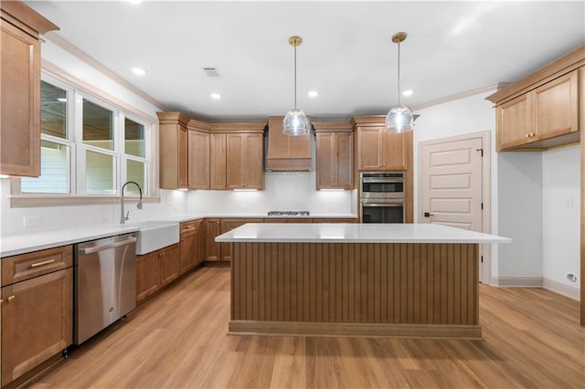 4786 Conns Creek Rd, Ball Ground, GA 30107 - kitchen featuring appliances with stainless steel finishes, light wood-type flooring, a kitchen island, light countertops, and decorative light fixtures