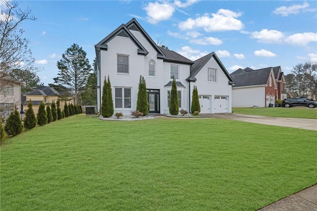 view of front of home with a garage and a front yard