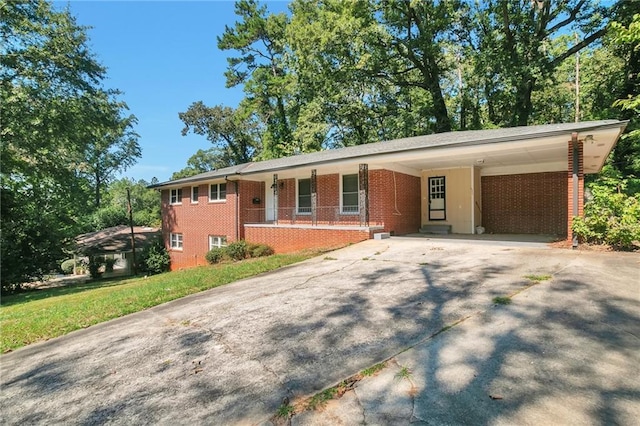 ranch-style house with a carport