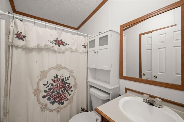 bathroom with a textured ceiling, crown molding, vanity, toilet, and a shower with curtain