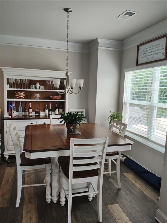 13 Mulberry Way, Cartersville, GA 30120 - dining space featuring dark wood finished floors, crown molding, and a chandelier