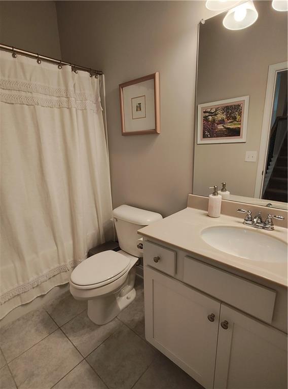 13 Mulberry Way, Cartersville, GA 30120 - bathroom featuring toilet, vanity, tile patterned floors, and a shower with curtain