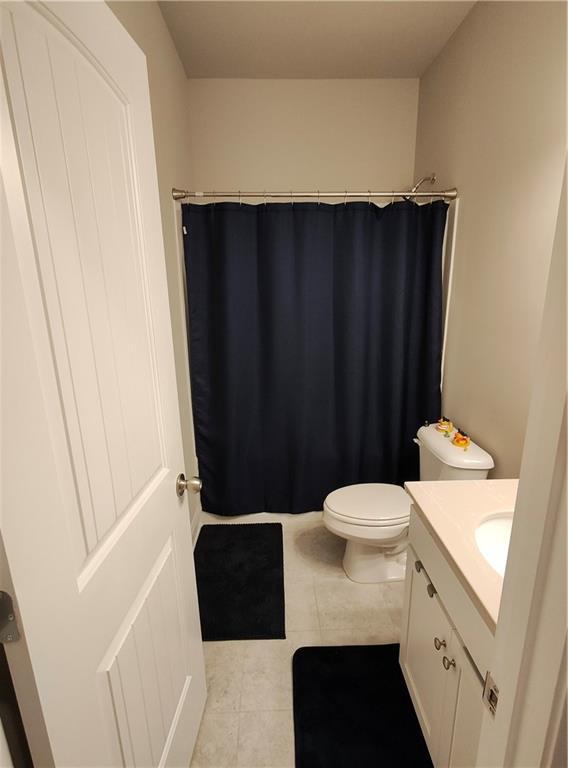 13 Mulberry Way, Cartersville, GA 30120 - bathroom with vanity, toilet, tile patterned flooring, and a shower with shower curtain