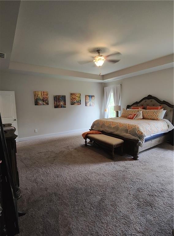 13 Mulberry Way, Cartersville, GA 30120 - carpeted bedroom featuring a raised ceiling, baseboards, and a ceiling fan