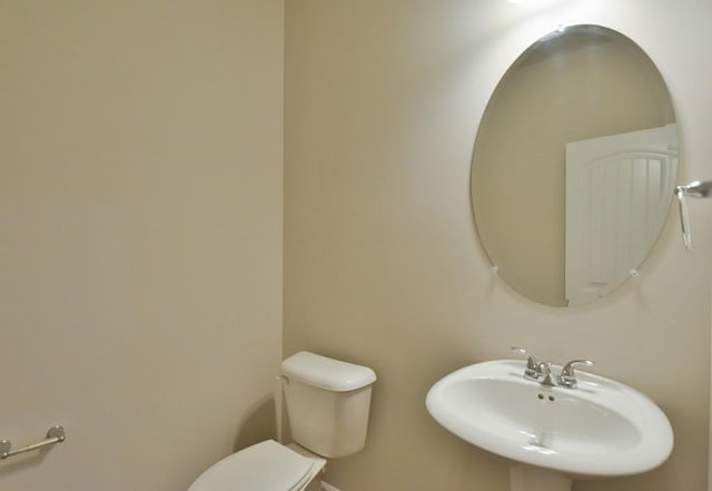 bathroom with toilet and sink