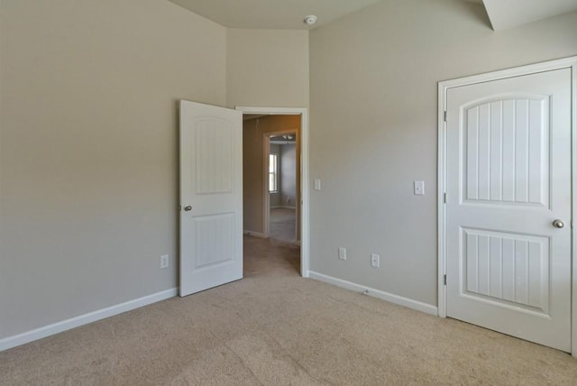 unfurnished bedroom with light colored carpet