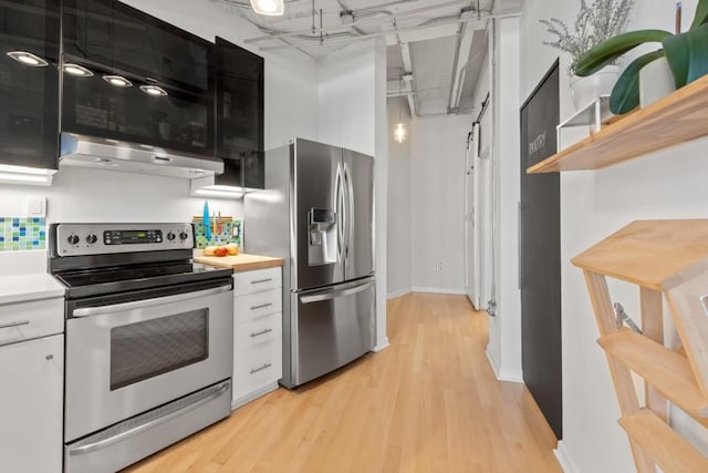 kitchen featuring white cabinetry, appliances with stainless steel finishes, and light wood-type flooring