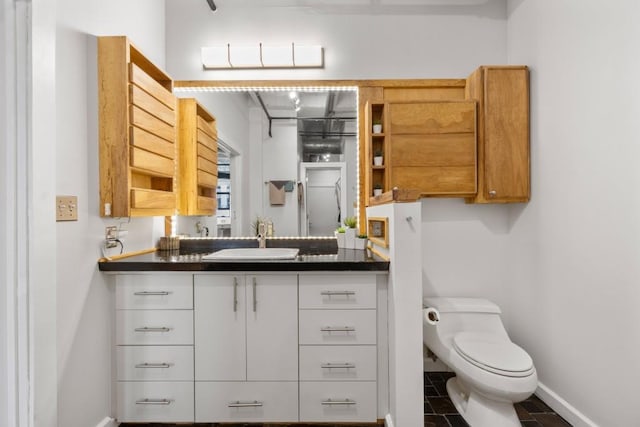 bathroom with vanity and toilet