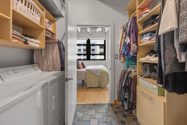 laundry room with washing machine and clothes dryer