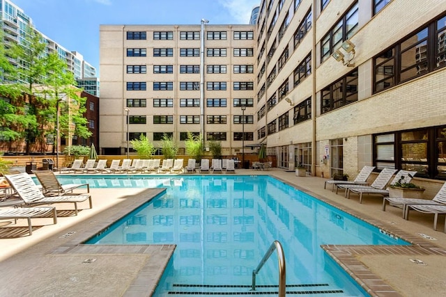 view of pool featuring a patio area