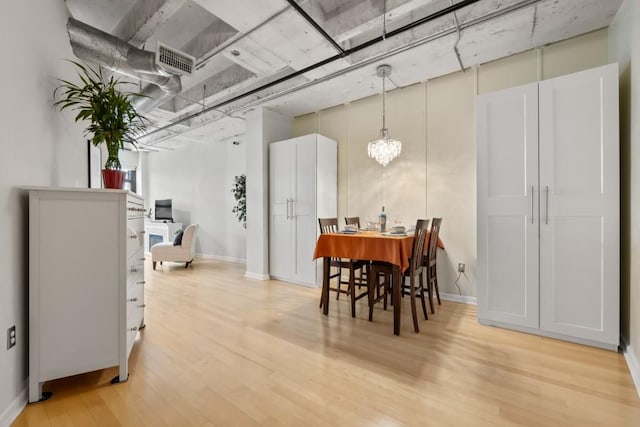 dining room with light hardwood / wood-style floors