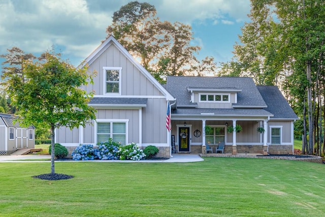 2980 Beards Rd, Buford, GA 30518 - craftsman house featuring roof with shingles, a front lawn, and board and batten siding