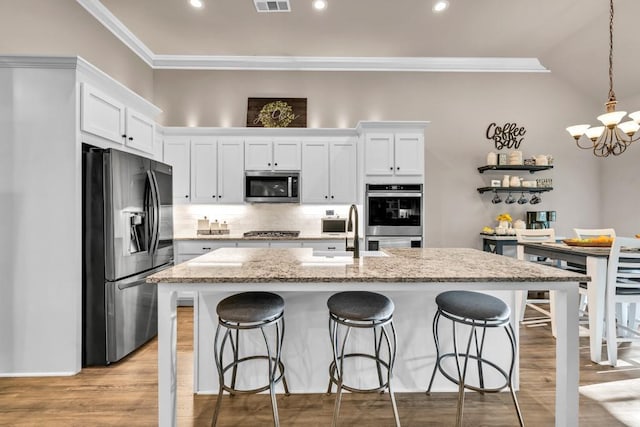2980 Beards Rd, Buford, GA 30518 - kitchen featuring stainless steel appliances, a sink, a chandelier, crown molding, and white cabinets