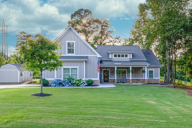 2980 Beards Rd, Buford, GA 30518 - craftsman-style home featuring board and batten siding, a porch, a front yard, and a shingled roof