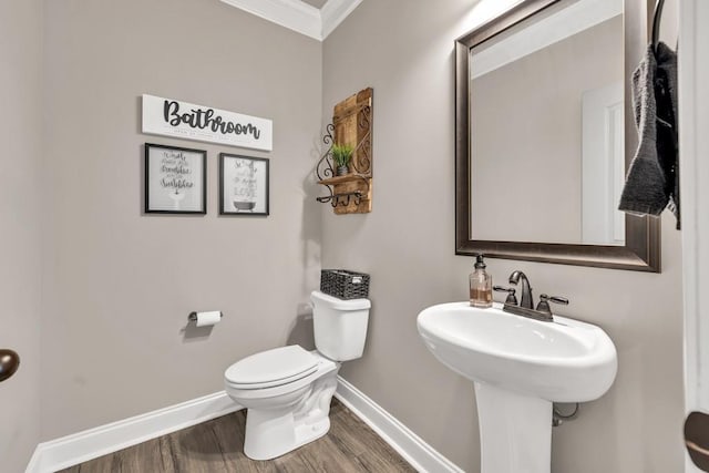 2980 Beards Rd, Buford, GA 30518 - half bath featuring baseboards, toilet, ornamental molding, and wood finished floors