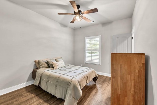 2980 Beards Rd, Buford, GA 30518 - bedroom with baseboards, dark wood-style flooring, and a ceiling fan
