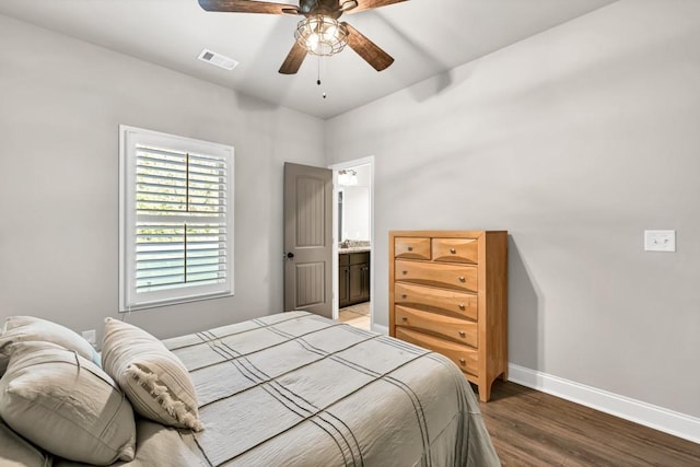 2980 Beards Rd, Buford, GA 30518 - bedroom with light wood-style flooring, baseboards, a ceiling fan, and ensuite bathroom