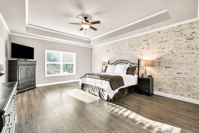 2980 Beards Rd, Buford, GA 30518 - bedroom featuring a raised ceiling, baseboards, wallpapered walls, wood finished floors, and crown molding