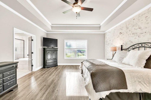 2980 Beards Rd, Buford, GA 30518 - bedroom featuring a raised ceiling, wood finished floors, ensuite bathroom, baseboards, and a ceiling fan