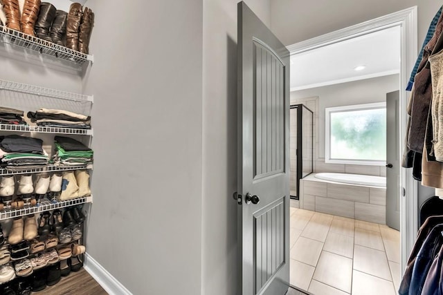 2980 Beards Rd, Buford, GA 30518 - full bath with a garden tub, a closet, ornamental molding, and baseboards