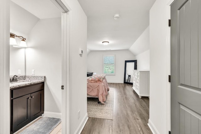 2980 Beards Rd, Buford, GA 30518 - ensuite bathroom featuring lofted ceiling, wood finished floors, vanity, and baseboards