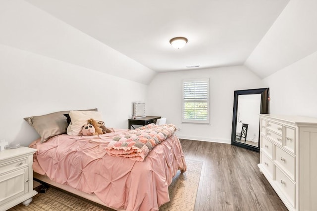 2980 Beards Rd, Buford, GA 30518 - bedroom featuring lofted ceiling, light wood-style floors, and baseboards