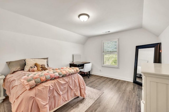 2980 Beards Rd, Buford, GA 30518 - bedroom featuring vaulted ceiling, wood finished floors, and baseboards