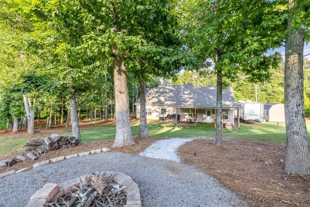 2980 Beards Rd, Buford, GA 30518 - view of grassy yard with a fire pit