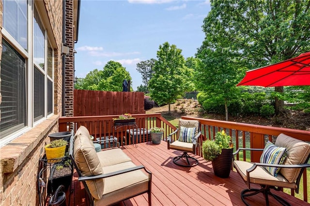 wooden terrace featuring outdoor lounge area