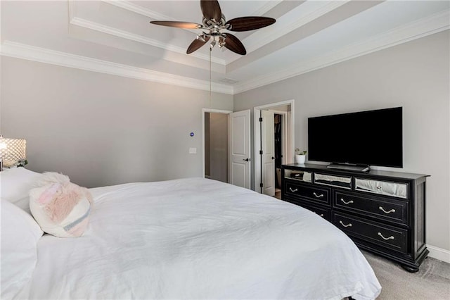 bedroom featuring a ceiling fan, crown molding, a raised ceiling, baseboards, and light carpet