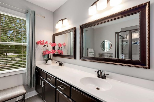 bathroom with double vanity and a sink