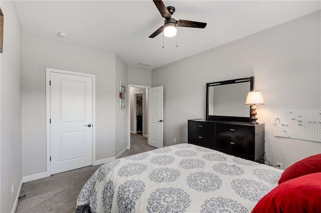 carpeted bedroom with baseboards and ceiling fan