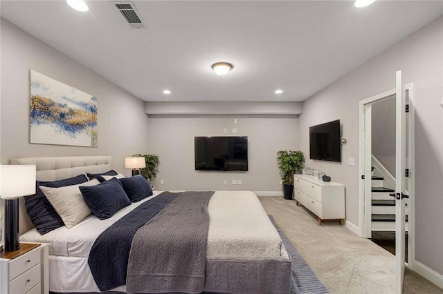 bedroom featuring recessed lighting, baseboards, visible vents, and light carpet