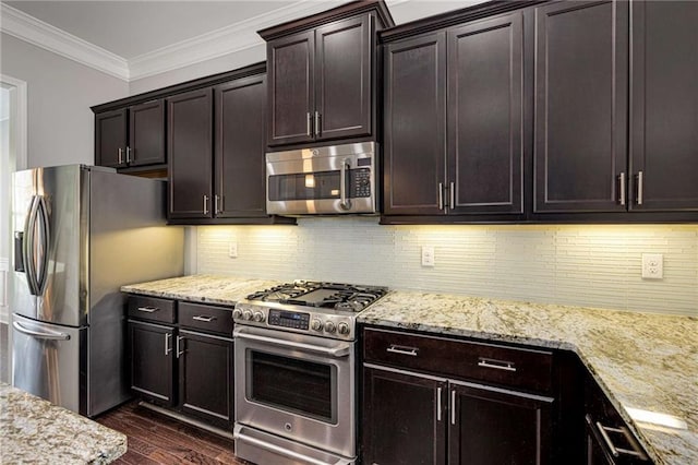 kitchen featuring crown molding, appliances with stainless steel finishes, dark wood finished floors, and light stone counters